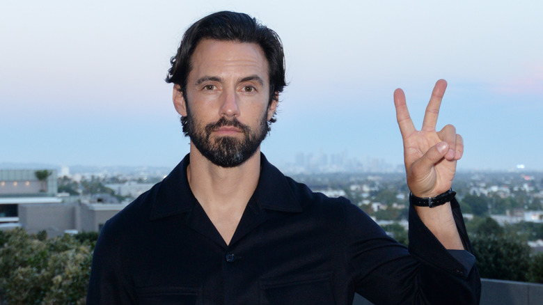 Milo Ventimiglia giving a peace sign