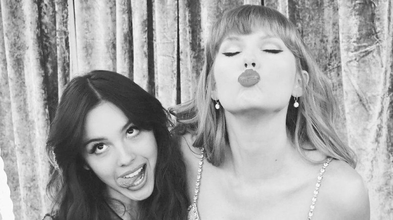 Olivia Rodrigo and Taylor Swift taking silly photo