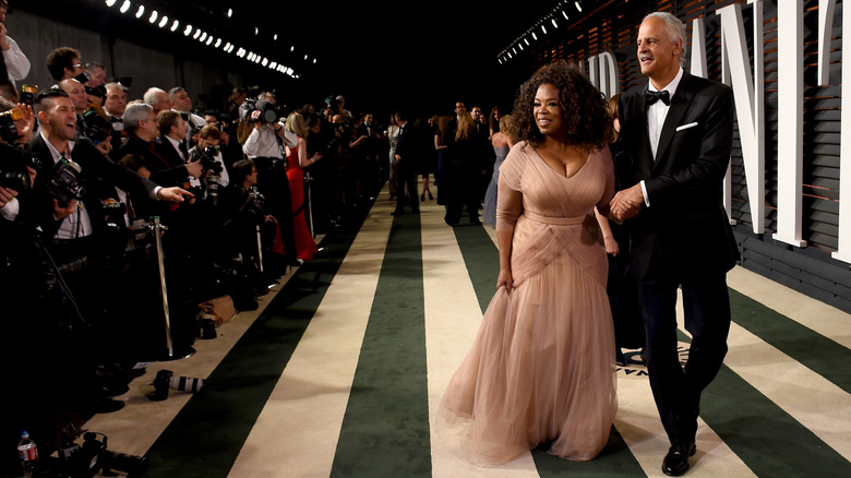 Oprah Winfrey with Stedman Graham walking