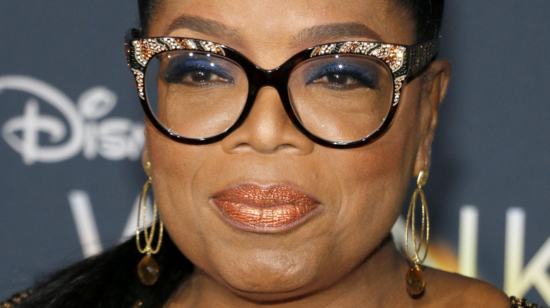 Oprah Winfrey smiling with lips closed