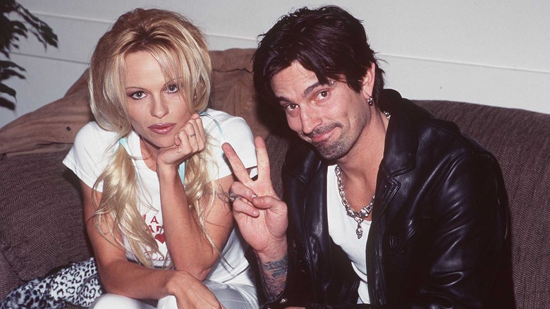 Pamela Anderson and Tommy Lee sit side by side