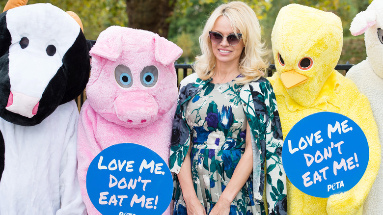 Pamela Anderson posing with PETA supporters