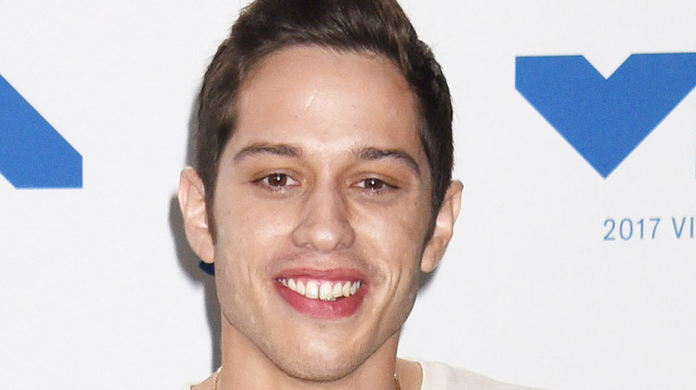 Pete Davidson smiling on the VMA red carpet