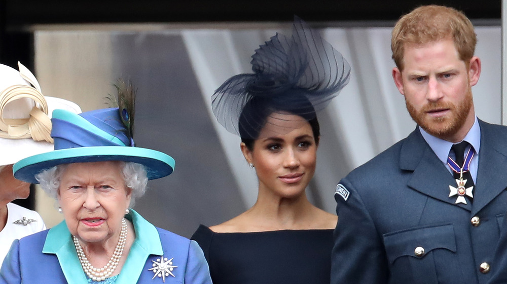 Queen Elizabeth II with Meghan Markle and Prince Harry