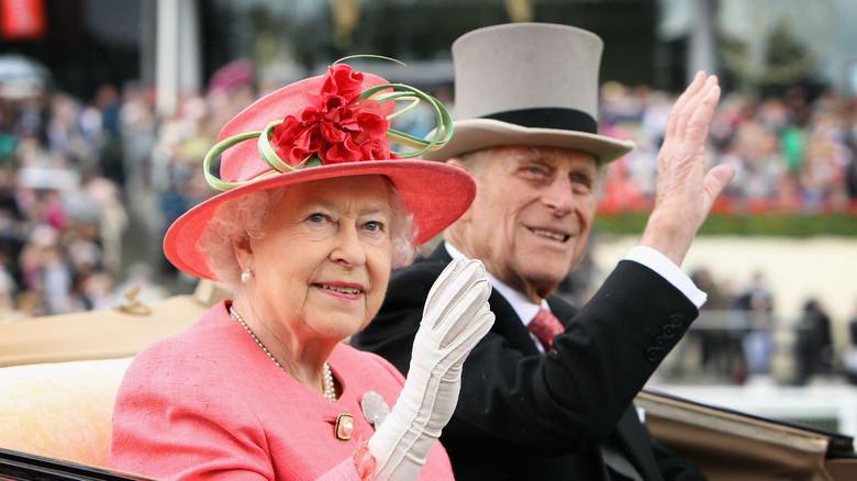 Queen Elizabeth II pink hat Prince Philip waving