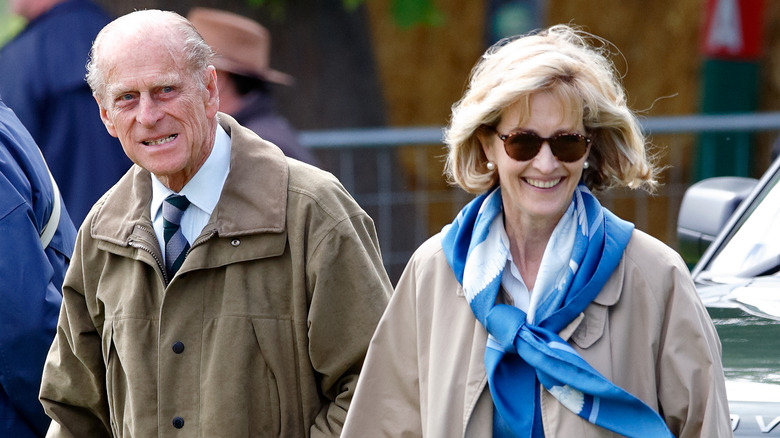 Prince Philip walking with Penny Knatchbull