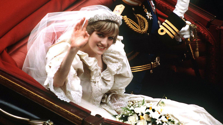 Princess Diana and Prince Charles riding away after their wedding