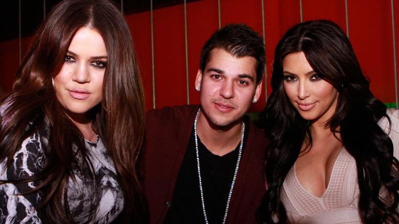 Khloe, Rob, and Kim Kardashian smiling