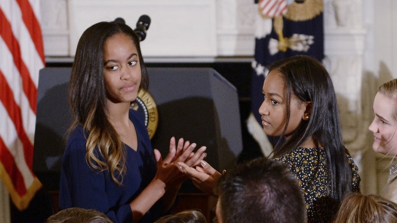 Malia and Sasha Obama at clapping