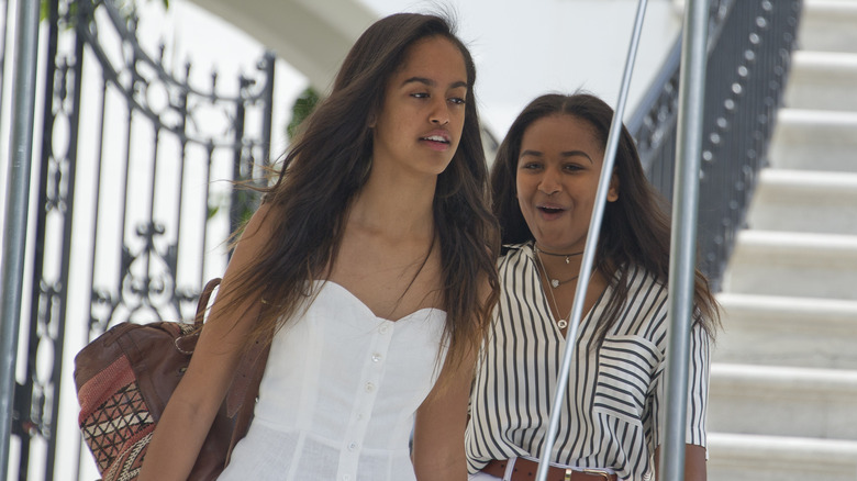 Sasha and Malia Obama walking