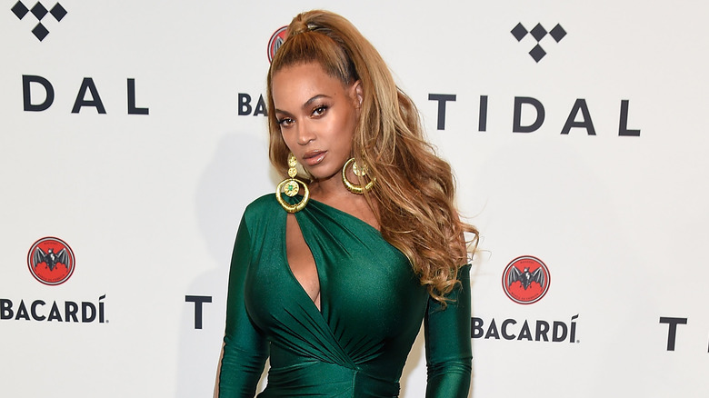 Beyoncé wearing a green dress