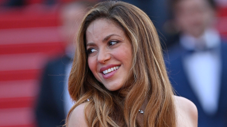 Shakira smiling for cameras