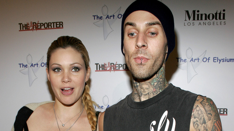 Shanna Moakler and Travis Barker posing