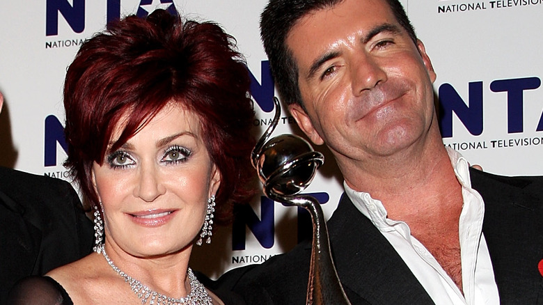 Sharon Osbourne and Simon Cowell pose with the award for Most Popular Talent Show