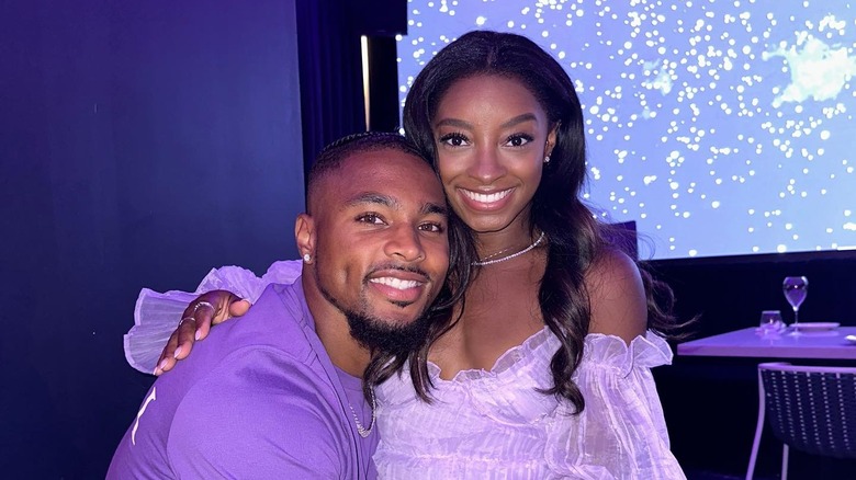 Simone Biles and Jonathan Owens posing