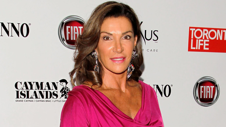 Hilary Farr posing in pink dress at an event