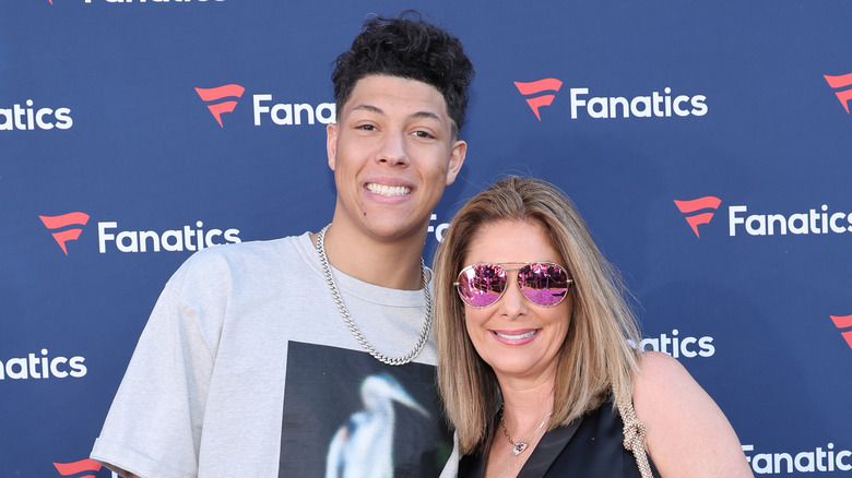 Jackson Mahomes and Randi Martin smile at red carpet event