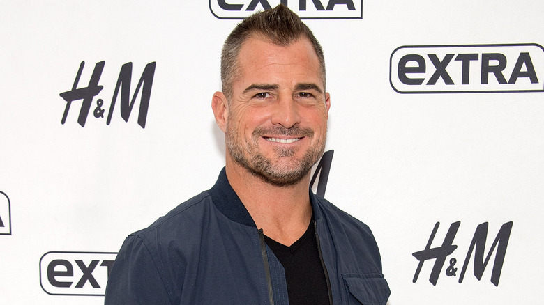 George Eads smiling, hair styled in fauxhawk