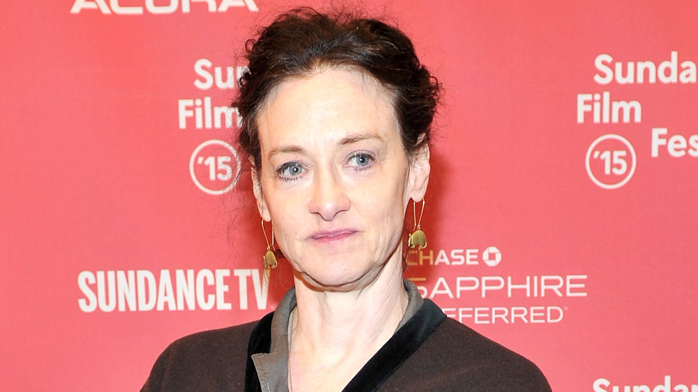 Joan Cusack smirking 