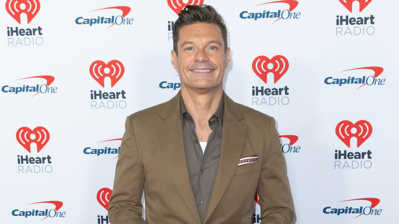 Ryan Seacrest wearing a tan suit