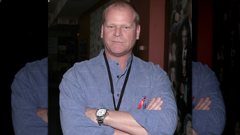 Mike Holmes folding his arms and looking at the camera.