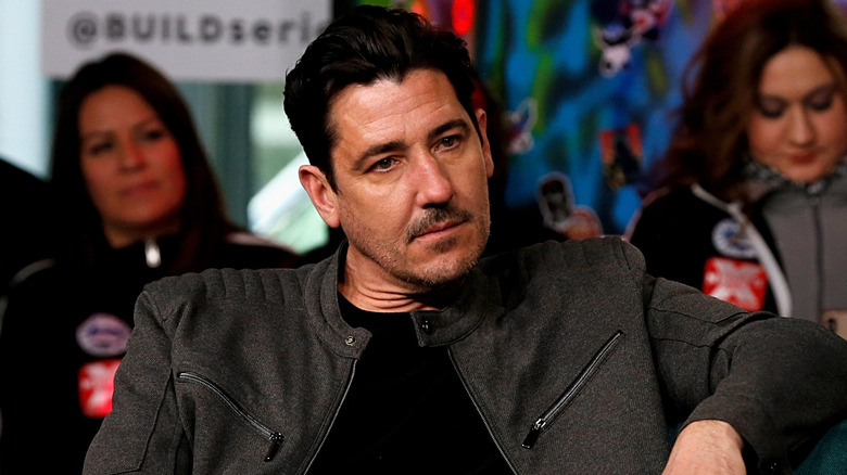 Jonathan Knight sitting down