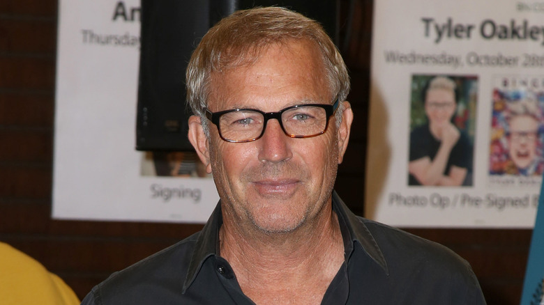 Kevin Costner wearing glasses