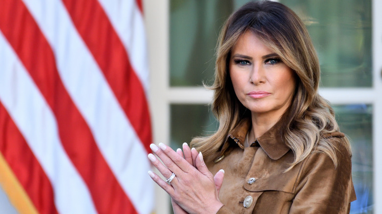 First Lady Melania Trump standing in the Rose Garden