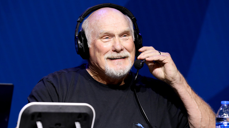 Terry Bradshaw wearing headphones