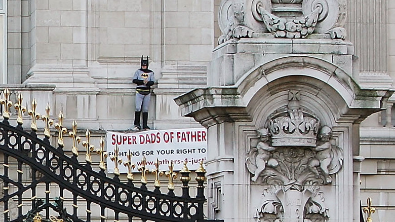 Jason Hatch, a Fathers 4 Justice campaigner dressed as Batman protesting on the balcony at Buckingham Palace