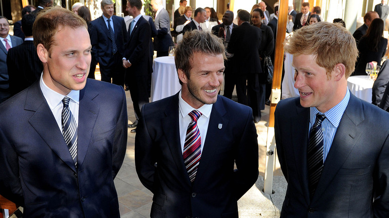 Prince William, David Beckham, and Prince Harry at an event 