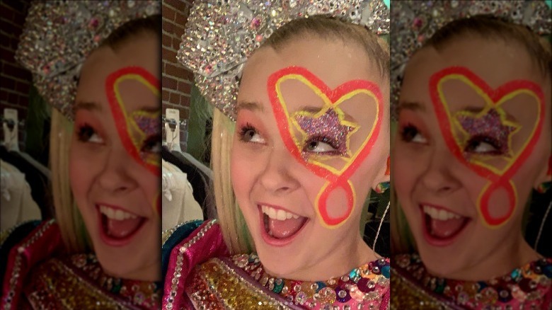 JoJo Siwa posing heart makeup