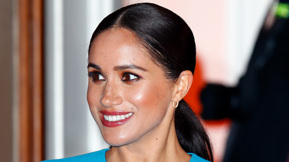 Meghan Markle smiling for the cameras