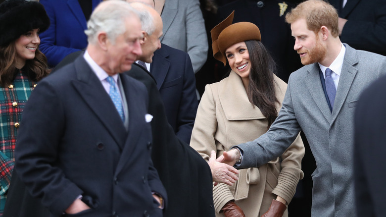 King Charles III, Meghan Markle, and Prince Harry