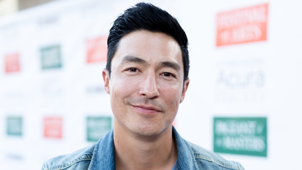 Daniel Henney smirking at the camera