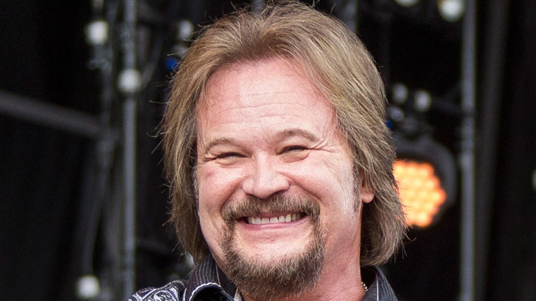 Travis Tritt performing on stage