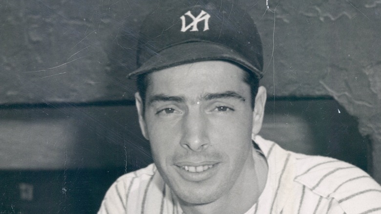 A young Joe DiMaggio wearing Yankees hat