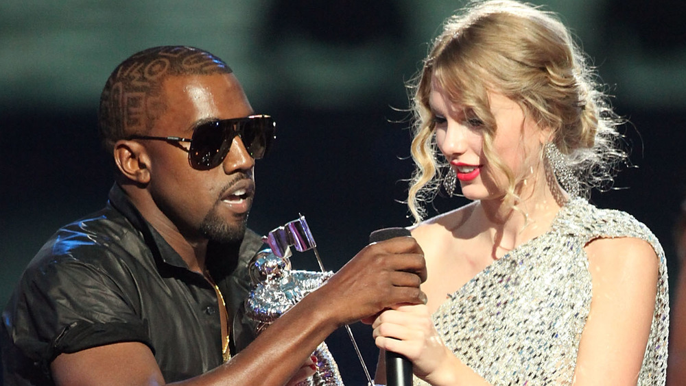 Kanye West grabbing Taylor Swift's microphone