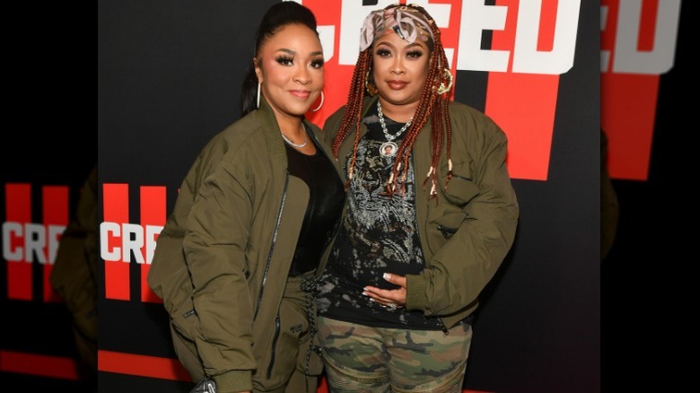 Da Brat cradling stomach with Jesseca Dupart