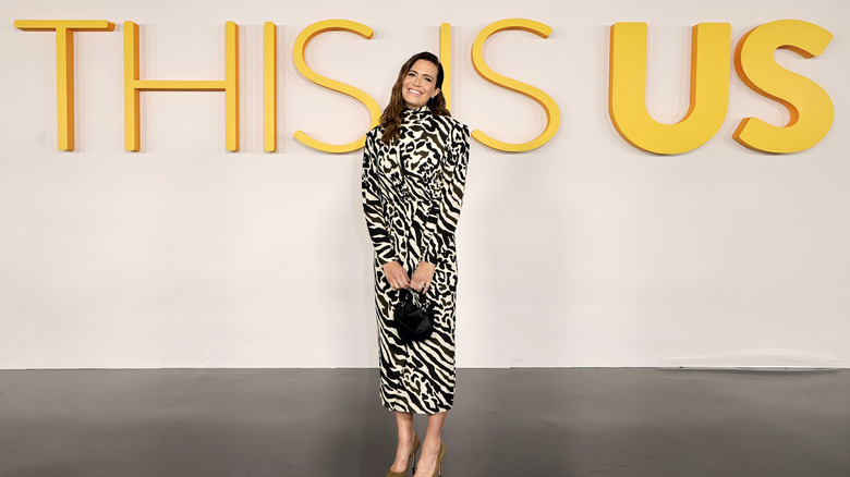 Mandy Moore posing in front of 'This Is Us' sign