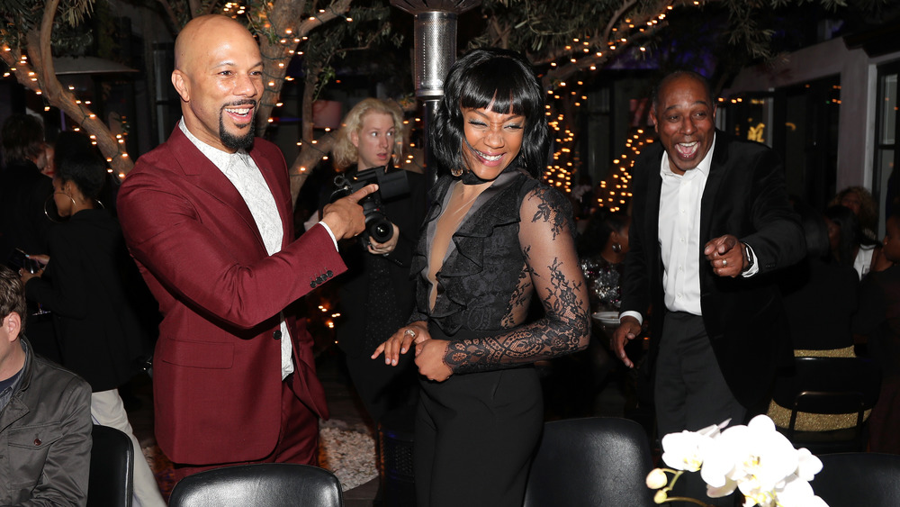 Tiffany Haddish and Common laughing