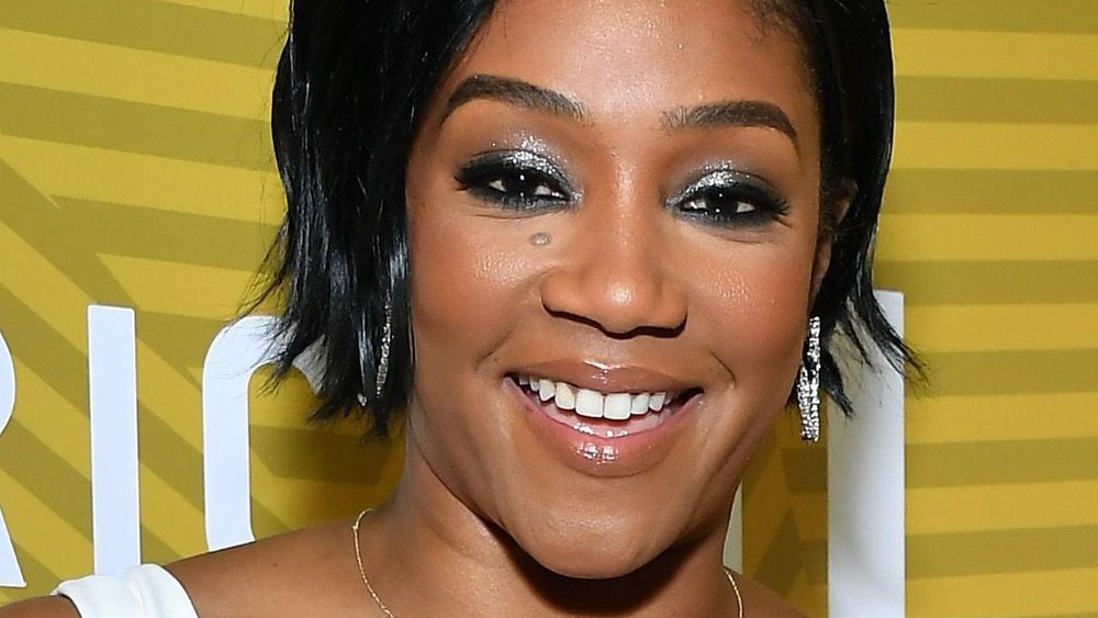 Tiffany Haddish smiling on the red carpet