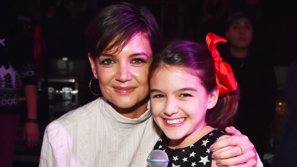 Katie Holmes and Suri Cruise hugging and smiling 