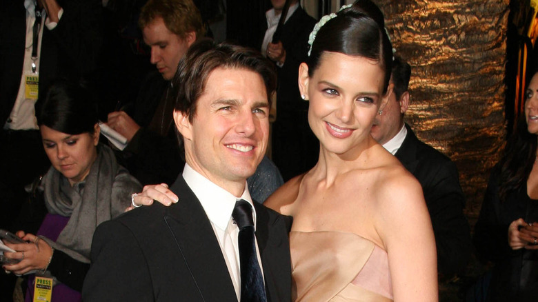 Tom Cruise posing with Katie Holmes