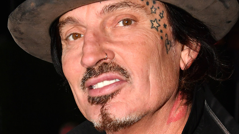 Tommy Lee with lipstick tattoo