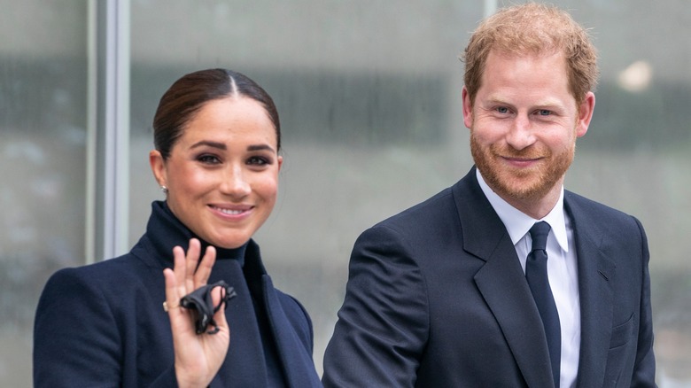 Prince Harry and Meghan Markle smiling at One World Observatory