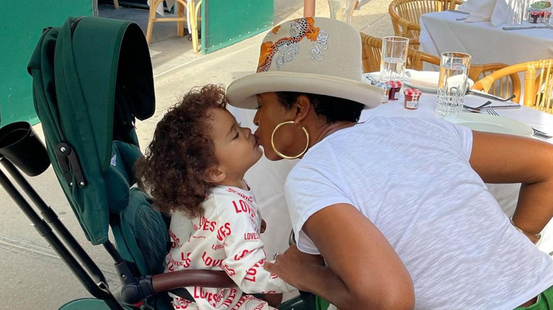 Tamron Hall gives son Moses a kiss 