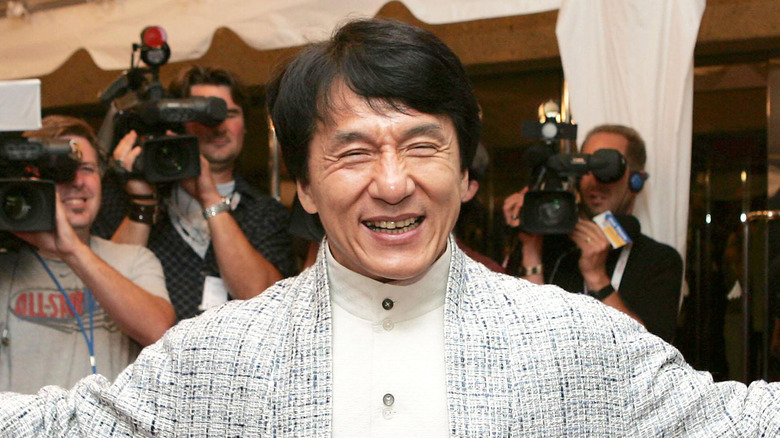 Jackie Chan posing for cameras