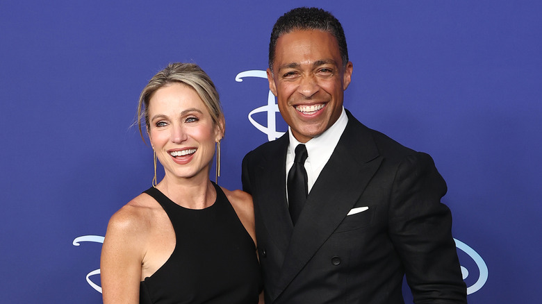 Amy Robach and T.J. Holmes smiling