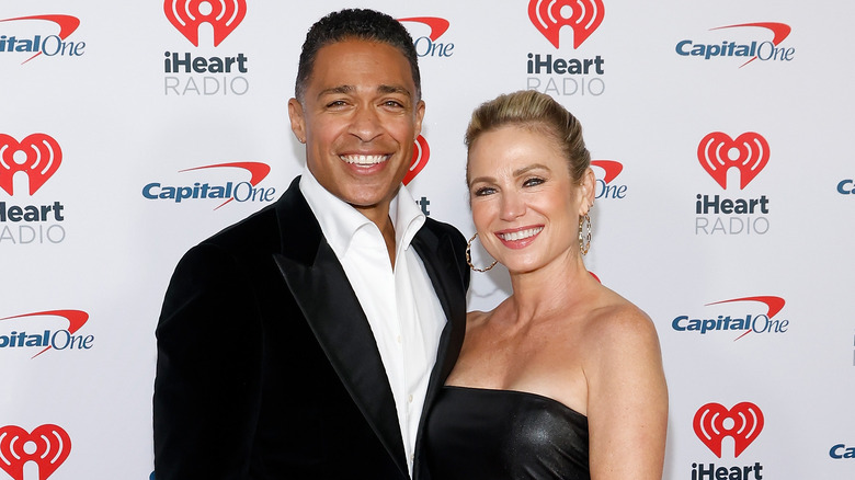 Amy Robach and T.J. Holmes smiling